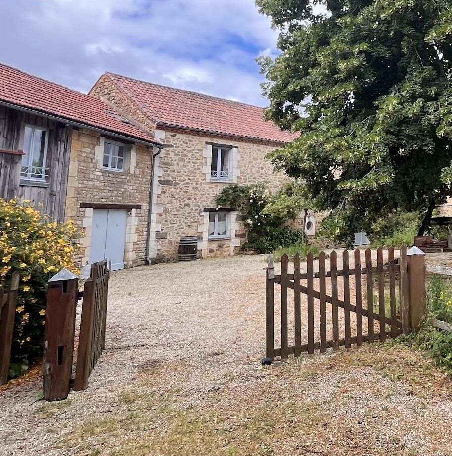 Stone farmhouse and garden gate at the retreat house